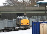 A pair of class 37s with a container train - unloading completed - at WHM Grangemouth in January 2005. DRS 37602 is nearest the camera with 37218 at the head of the train.<br><br>[John Furnevel 15/01/2005]