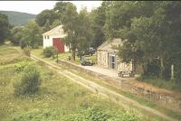 Blacksboat showing the station and goods shed, viewed from road bridge, Summer 1994.<br><br>[John Gray //]