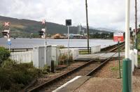 Platform view from Corpach station on 30 September 2005 looking west over the level crossing towards the paper mill.<br><br>[John Furnevel 30/09/2005]