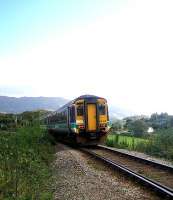 Afternoon train from Mallaig drops down towards Loch Morar shortly after leaving Morar station in September 2005.<br><br>[John Furnevel /09/2005]