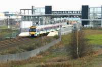View east over Edinburgh Park station in December 2004 with a Waverley - Queen Street shuttle passing at speed.<br><br>[John Furnevel 08/12/2004]