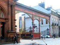 Entrance to the former Princes Street station, Edinburgh, in April 2002. The area immediately beyond the gates is now a car park serving the Caledonian Hotel on the left.<br><br>[John Furnevel 28/04/2002]