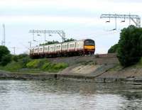 A Helensburgh bound train skirts the north shore of the River Clyde near Cardross in July 2005.<br><br>[John Furnevel 27/07/2005]
