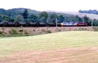 Down coal empties approaching Beattock station from the south in 1997, double headed by a pair of class 37s sporting EWS and BR Railfreight Metals sector liveries.<br><br>[John Furnevel //1997]