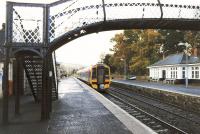 Platform scene at Pitlochry in November 1999 as First ScotRail 158722 departs with a southbound service.<br><br>[John Furnevel 02/11/1999]
