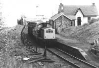 Clayton 8528 with a short rake of wagons at Loanhead station in January 1971. The lifted sidings once served the Ramsay Colliery, which stood off to the left and was officially closed in 1965 [see image 24338]. The line continued to handle traffic from Bilston Glen Colliery until 1991.<br><br>[John Furnevel 29/01/1971]