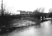 A lengthy southbound freight crossing the River Caldew on the Carlisle goods lines on 8 December 1968, hauled by a pair of type 2 locomotives.<br><br>[John Furnevel 08/12/1968]