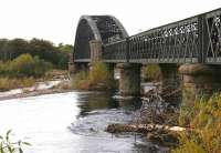 The Spey Viaduct in the autumn of 2005, looking west towards Garmouth. The angle shows the three eastern approach spans and the central Bowstring structure. <br><br>[John Furnevel 30/10/2005]
