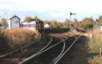 An Aberdeen - Inverness train held awaiting the crossing service alongside Forres East signal box in November 2005.<br><br>[John Furnevel 04/11/2005]