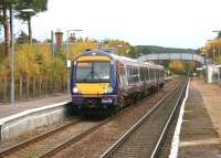 A Glasgow Queen Street - Inverness train pulls away from Carrbridge in November 2005.<br><br>[John Furnevel 01/11/2005]