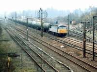A 'Transrail' liveried class 56 with northbound oil empties passing Beattock in April 1999.<br><br>[John Furnevel 05/04/1999]