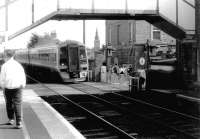 A southbound train entering Broughty Ferry station over the level crossing in 1996.<br><br>[John Furnevel 04/08/1996]