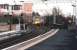 Platform view east from Partick station on a February afternoon in 2005 as a train for Milngavie approaches. Yorkhill Hospital stands in the left background.<br><br>[John Furnevel 23/02/2005]