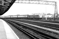 A BR class 73 Electro-Diesel locomotive approaching the carriage sidings at Clapham Junction with empty stock from Waterloo on 2 June 1973.<br><br>[John Furnevel 02/06/1973]