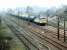 A 'Transrail' liveried class 56 with northbound oil empties passing Beattock in April 1999.<br><br>[John Furnevel 05/04/1999]