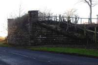 The northern abutment of the old railway bridge that once carried the Maidens and Dunure Light Railway over the A719 north of Maidens station [see image 50039].<br><br>[Colin Miller 03/01/2015]