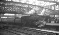 Ivatt 4MT 2-6-0 no 43000 adds to the atmostphere around the footbridge at Carlisle on 11 April 1964, after arriving with the Saturday morning 10.48am train from Langholm.<br><br>[K A Gray 11/04/1964]