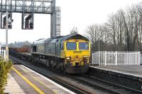 Freightliner 66527 with a ballast train, runs through Didcot station on 22 January 2015. Ultimate destination is the virtual quarry at Hinksey, just south of Oxford.<br><br>[Peter Todd 22/01/2015]