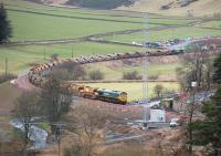Ballast train a little to the north of Bowshank Tunnel on 27 January 2015 with Freightliner class 66 locomotives 66613 (leading) and 66614 in charge.<br><br>[Bill Roberton 27/01/2015]