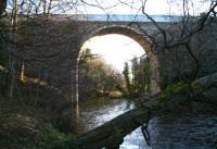Early morning view east along the valley of the North Esk towards Dalkeith on 1 February 2015 through the single arch of Glenesk Viaduct, now carrying the Borders Railway. [See image 33085]<br><br>[John Furnevel 01/02/2015]