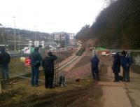 Tracklaying at Galashiels on 3 February 2015 with the train alongside the new Galashiels station.<br><br>[John Yellowlees 03/02/2015]