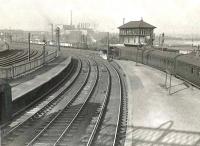 View north over Rutherglen station on 10 March 1956. On the right a train for Balloch is preparing to leave behind Caley 0-6-0 57631.<br><br>[G H Robin collection by courtesy of the Mitchell Library, Glasgow 10/03/1956]