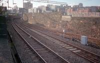 An overview of Bridgeton Central Junction looking west to High Street station in 1987. The remaining wall of the NBR's High Street Goods shed is just visible on the far right.<br><br>[Ewan Crawford //1987]