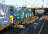 DRS 68007 and 68004 double head the 4S43 Daventry to Mossend Tesco container train through Leyland station on the morning of 6 February 2015.<br><br>[John McIntyre 06/02/2015]