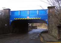 Freshly painted in fine Caledonian blue, this bridge carries the Carstairs line over Murieston Crescent, Edinburgh, south west of Haymarket station. The track here had to be modified to allow full running out of Haymarket when Princes Street station closed in 1965, as the Haymarket divergence was then single track at this point. The divergence at Granton Junction, where it separated from the once far more important CR Granton branch, was just to the left.<br><br>[David Panton 07/02/2015]