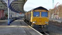 GBRf 66745 powers through Kilmarnock station on 5 February 2015 with loaded coal hoppers from Hunterston to Drax power station. This is a new path for GBRf.<br><br>[Ken Browne 05/02/2015]