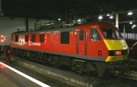 Recently repainted DB Schenker locomotive 90018 at the dimly lit south end of Euston's platform 16 on the evening of 10th February 2015. The locomotive would later take out the Highland <I>Caledonian Sleeper</I>, now in its last months of operation by First Scotrail before being taken over by Serco.<br><br>[Colin McDonald 10/02/2015]