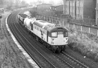 26001 passes the former Duddingston and Craigmillar Station with a short freight on 11 December 1989.<br><br>[Bill Roberton 11/12/1989]
