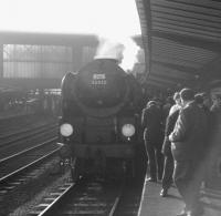 A crowded platform 4 at Carlisle on 13 June 1964 to see rebuilt 'Merchant Navy' Pacific no 35012 <I>United States Lines</I> at the head of the RCTS (West Riding Branch) <I>'Solway Ranger'</I>. The special was about to head south over the Settle & Carlisle on its way back to Leeds City. [See image 38241]<br><br>[K A Gray 13/06/1964]