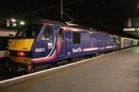 Locomotive 90021, still in EWS ScotRail livery, stands at Euston platform 15 on 10th February 2015 just after bringing in the empty stock of the Lowland Caledonian Sleeper.<br><br>[Colin McDonald 10/02/2015]