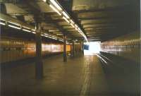 Anderston was a more atmospheric (or do I mean gloomy?) place before the white suspended ceiling was installed above the island platform. Here it is in July 1998, looking westwards. [See image 27786]<br>
<br><br>[David Panton 17/07/1998]