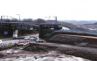 The Cutty Sark (Braehead) construction site viewed from Bredisholm Road on 25th February 2015 [see image 46153]. The new viaduct over the M8 extension will be constructed alongside the railway line and slid into place during a 2-week line closure in July 2015.<br><br>[Colin McDonald 25/02/2015]