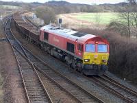 DBS 66097 passes Inverkeithing East Junction on 1 March with an empty Alloa - Millerhill ballast train.<br><br>[Bill Roberton 01/03/2015]