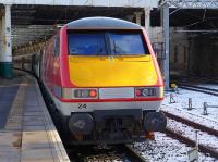 VTEC 91124 brings up the rear of the 12.00 service to Kings Cross at a wintry Edinburgh Waverley on 3 March.<br><br>[Bill Roberton 03/03/2015]