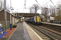 The 1430 Glasgow Central to Ayr train hammers through [and I mean hammers through] Lochwinnoch station on 5 March 2015.<br><br>[Colin Miller 05/03/2015]