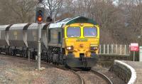 Freightliner 66529 with the 4S11 Drax - Hunterston empties about to pass through Kilmarnock station on 5 March.<br><br>[Ken Browne 05/03/2015]