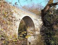 The sweeping single arch of the Edinburgh and Dalkeith Railway Company's Glenesk Viaduct (1830), seen from the east side illuminated by March sunshine in 2007. Photograph taken from the steep sided valley of the North Esk, on the edge of Dalkeith's Ironmills Park. [See image 14929]<br><br>[John Furnevel 12/03/2007]