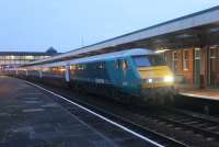 0618hrs at Llandudno Junction on 16th March and the Holyhead to Cardiff <I>Y Gerallt Gymro</I> funded service is running <I>right time.</I> DVT 82307 leads the train along the North Wales coast while 67029 is the propelling loco but the train will reverse at Chester forward the run south. (See recent news item)<br><br>[Mark Bartlett 16/03/2015]