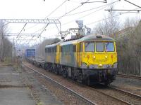Freightliner 86637+86605 approaching Coatbridge Central on 17 March with the 14.01 Coatbridge FLT - Crewe Basford Hall containers.<br><br>[Bill Roberton 17/03/2015]