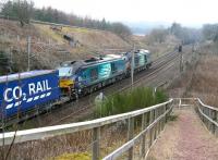 The late running 0616 Daventry - Mossend containers speed past a network Rail access point just south of Beattock summit on 18 March 2015. The lengthy train is double headed by DRS 68002+68004 <br><br>[John Furnevel 18/03/2015]