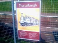 A Kenny Munro poster alongside the platform at Musselburgh station in March 2015, featuring North British locomotive 313 <I>'Musselburgh'</I> and the Robert Louis Stevenson poem <I>From a Railway Carriage</I>.<br><br>[John Yellowlees 20/03/2015]