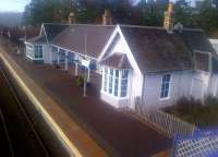 View north at Carrbridge on 23 March, with the station building gleaming in the early spring sunshine.<br>
<br><br>[John Yellowlees 23/03/2015]