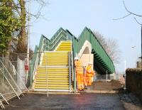 The new footbridge over the Borders Railway on Plumtreehall Brae, Galashiels, replacing the road bridge that previously crossed the line here. View north on 18 March 2015, at which time the bridge was not officially open, with finishing touches being applied. [See image 49909]<br><br>[John Furnevel 18/03/2015]