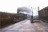 St Rollox Black 5 44718 brings a Buchanan Street - Dundee train into Stirling in February 1965.<br><br>[John Robin 07/02/1965]