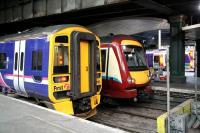 Colourful combination at the west end of Waverley in December 2006.<br><br>[John Furnevel 02/12/2006]