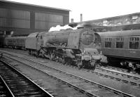 Stanier Pacific 46240 City of Coventry stands on the centre road at Carlisle on 12 April 1963, having just come off the 10.5am Glasgow Central - Birmingham New Street. The train is at platform 4, now in the hands of BR Britannia Pacific no 70044 <I>'Earl Haig'</I>, waiting to restart its journey south. [See image 35550]<br><br>[K A Gray 12/04/1963]
